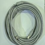 Coiled grey USB cable on surface
